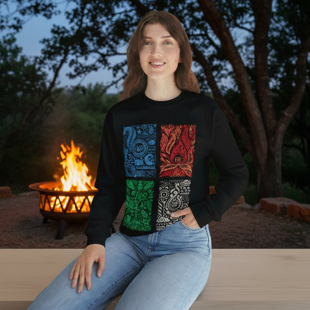 Person wearing a black sweater with colorful geometric patterns sitting on a white surface with a plant in the background.